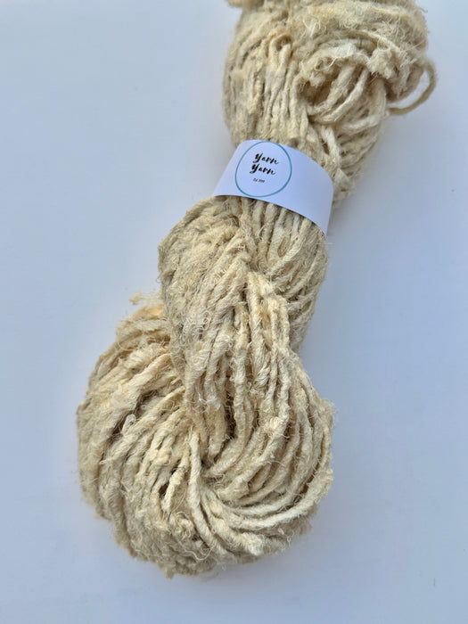 Natural white sari silk yarn.