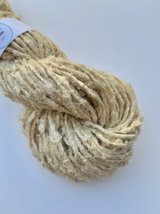 Natural white sari silk yarn.