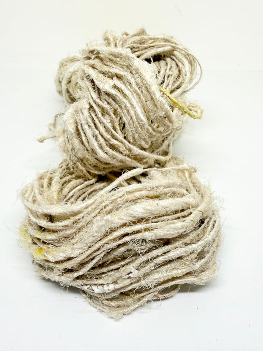 Natural white sari silk yarn.