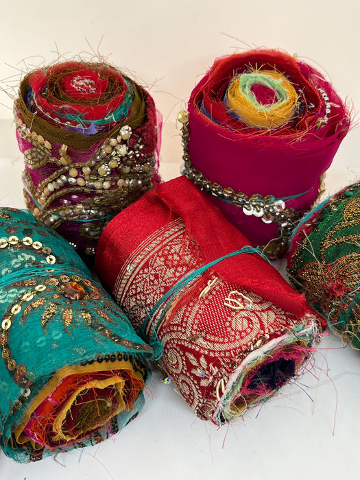 Embroidered, embellished silk rolls.